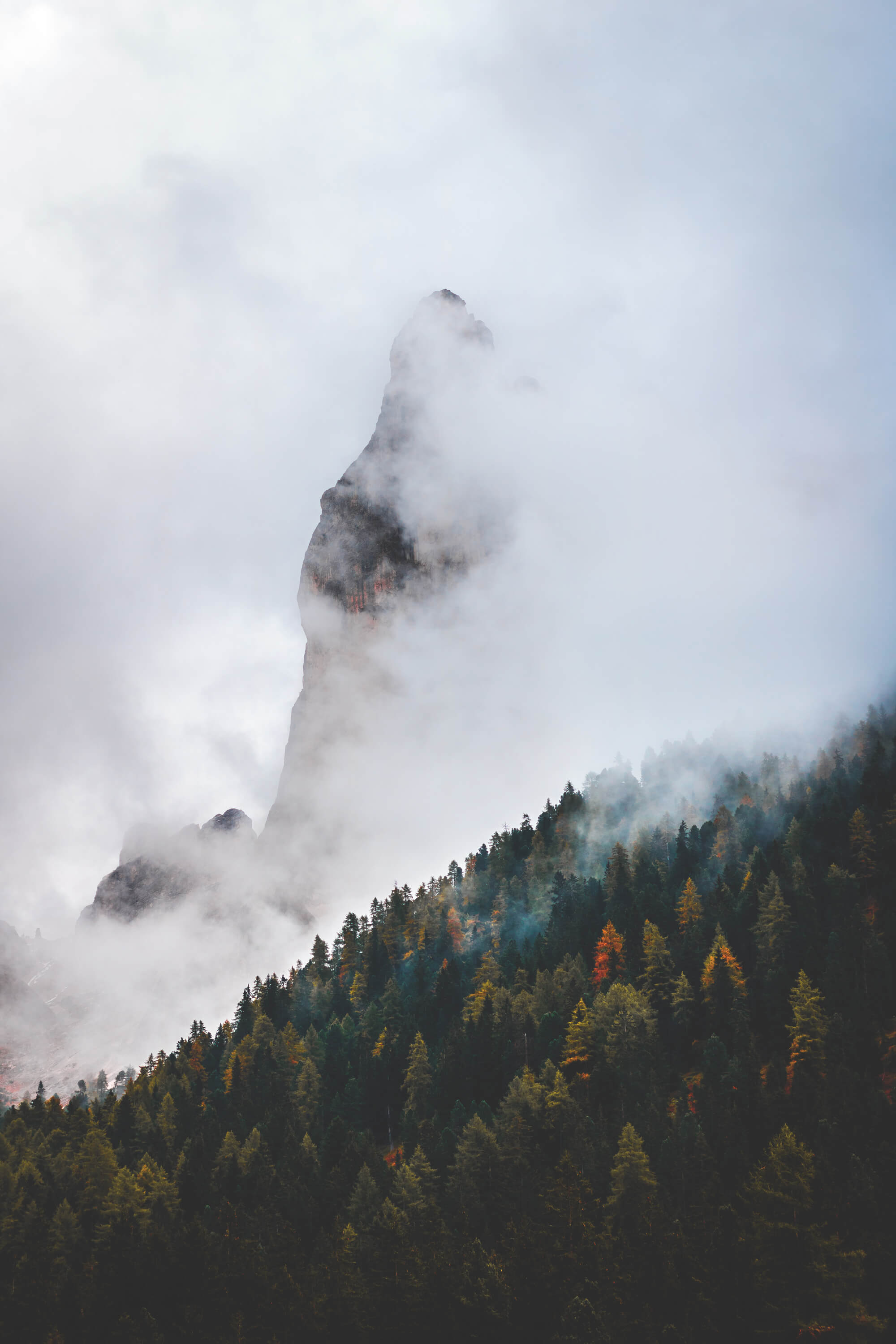 Spiky mountain covered in clouds